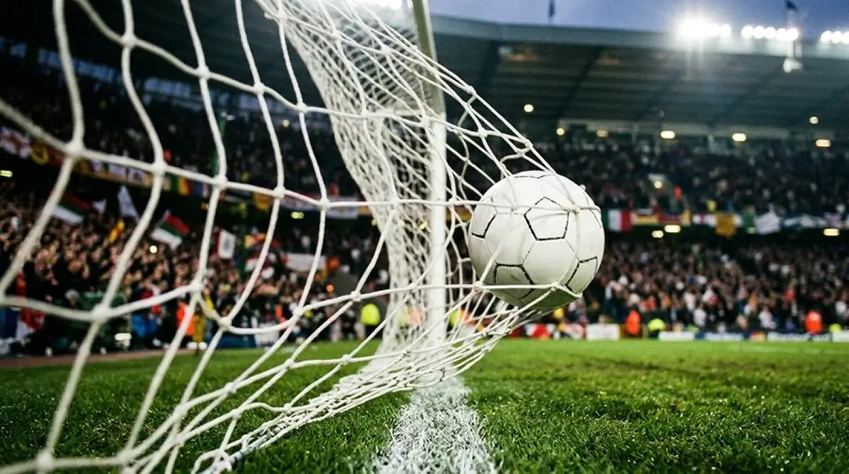 Ballon franchissant la ligne de but dans les filets, symbole d'un match à rebondissements